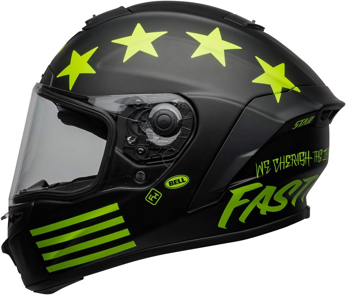 Bell Star DLX MIPS helmet in black with neon green stars, graphics, and lettering, featuring a clear visor and Panovision optics.