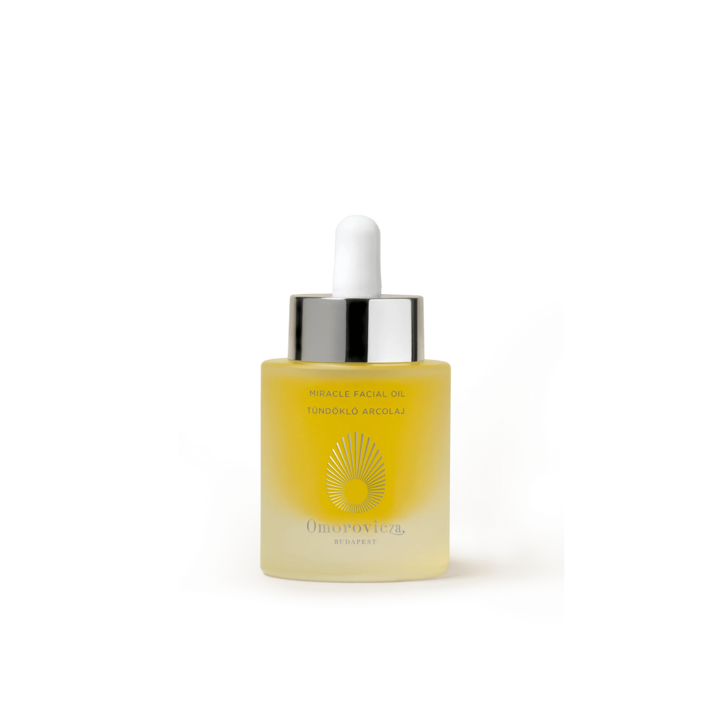 A bottle of Omorovicza Miracle Facial Oil, a luxurious bakuchiol-infused facial oil for hydrated and radiant skin.