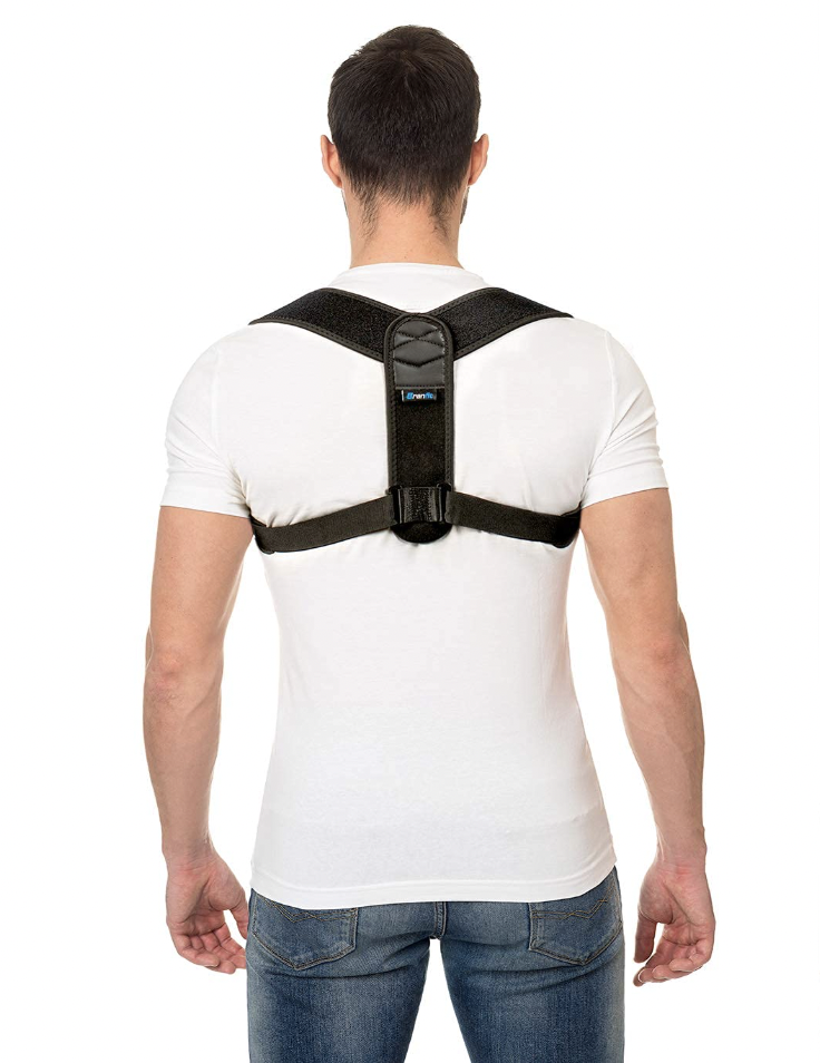 A man is shown from the back wearing a black posture corrector brace over a white t-shirt, highlighting the upper back support structure.