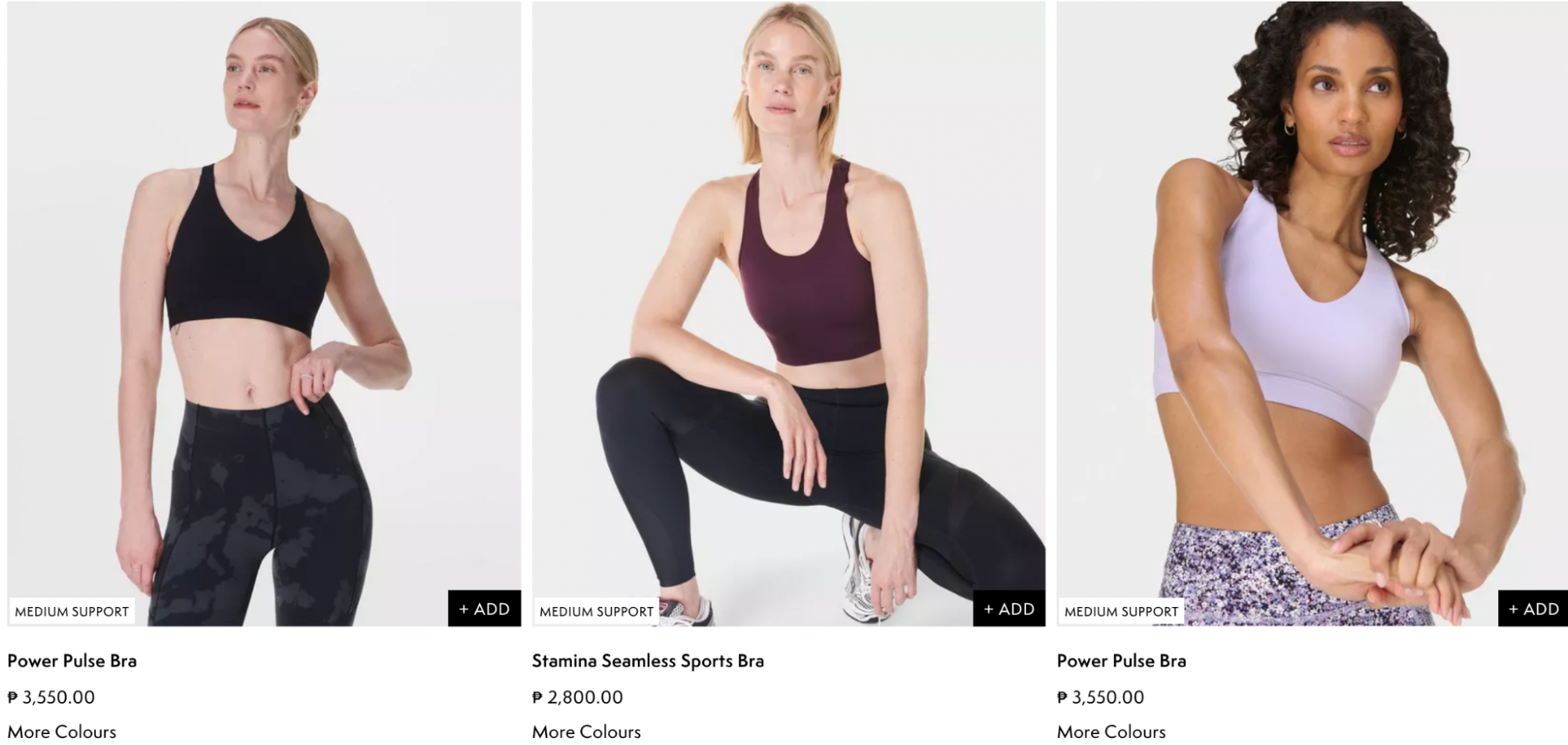 Three women model Sweaty Betty’s medium support sports bras, including the Power Pulse Bra and Stamina Seamless Bra, ideal for Pilates, gym sessions, and activewear styling.