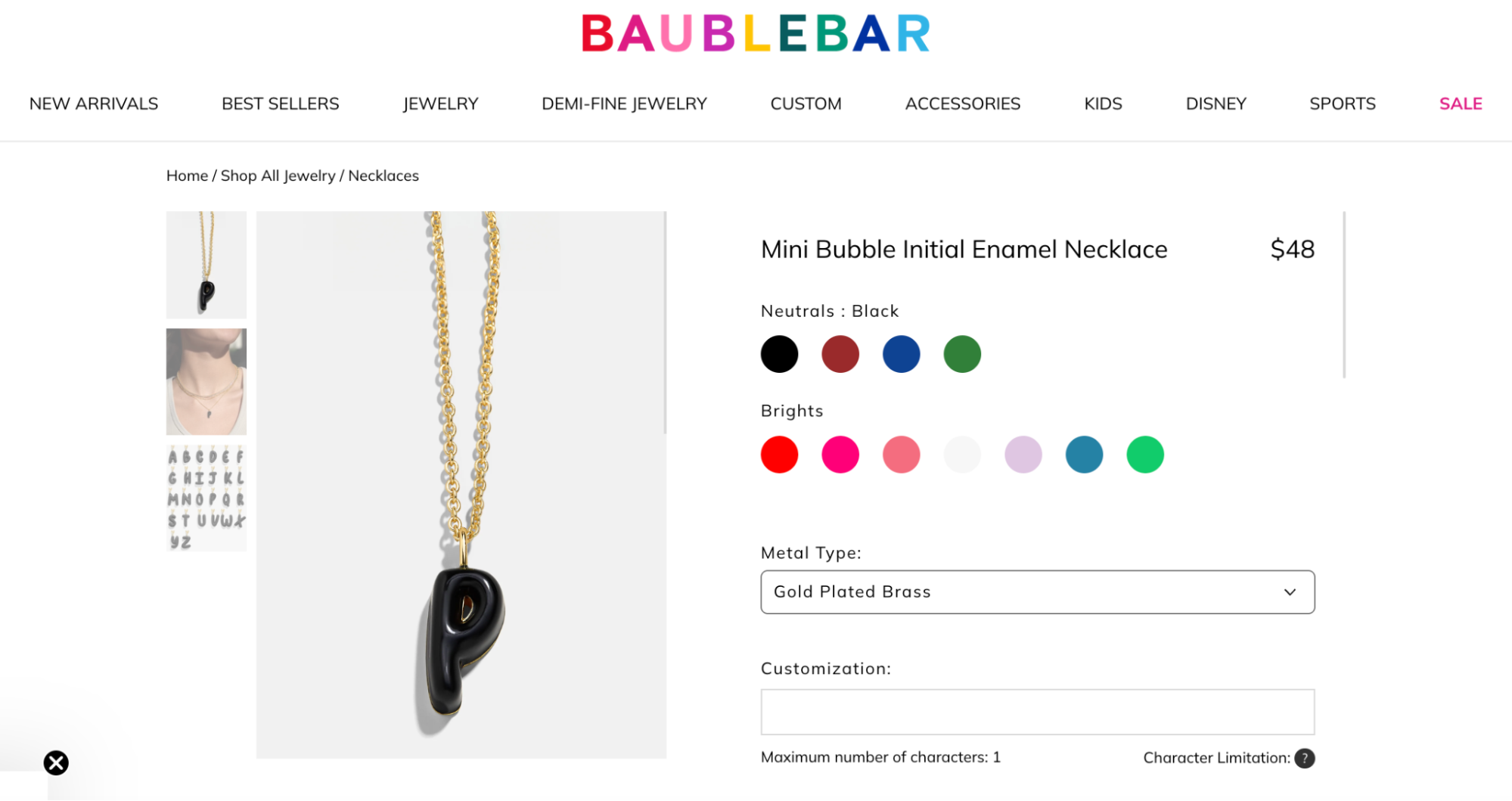 A BaubleBar mini bubble initial necklace with a black enamel letter “P” pendant on a gold-plated chain, shown with multiple color options.