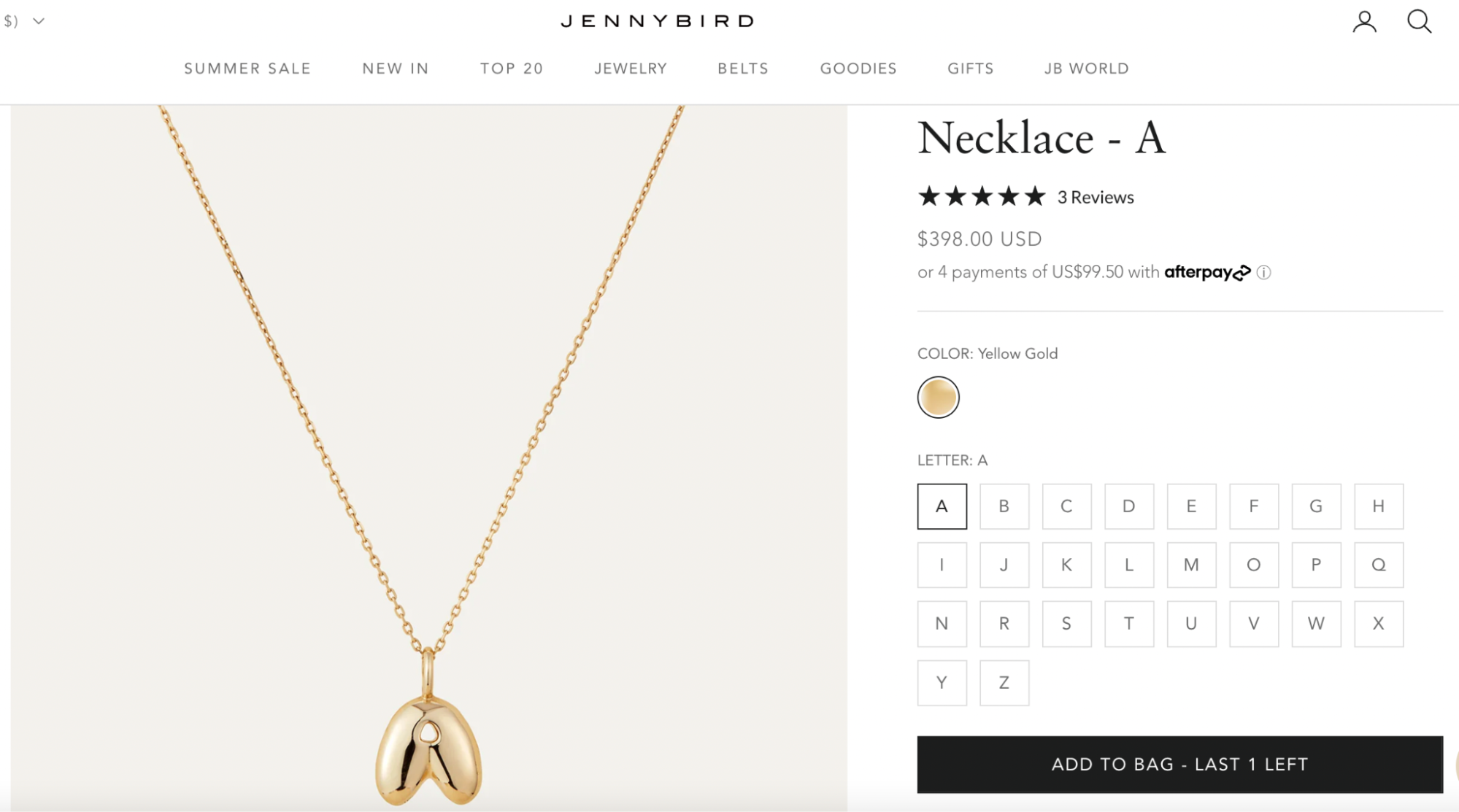 A 14K yellow gold bubble letter “A” necklace by JennyBird, featuring a sleek, polished puff pendant on a fine gold chain.