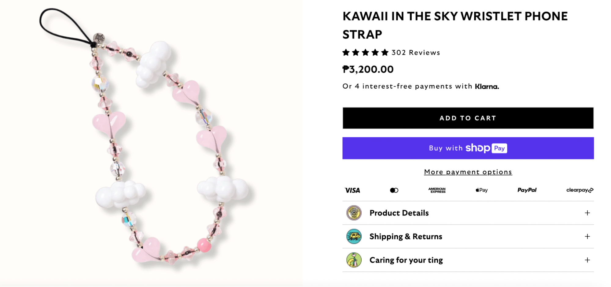 A whimsical phone wristlet strap featuring pastel pink heart beads, iridescent crystal accents, and puffy white cloud charms. This kawaii-style accessory adds a dreamy and playful touch to your phone or wristlet.