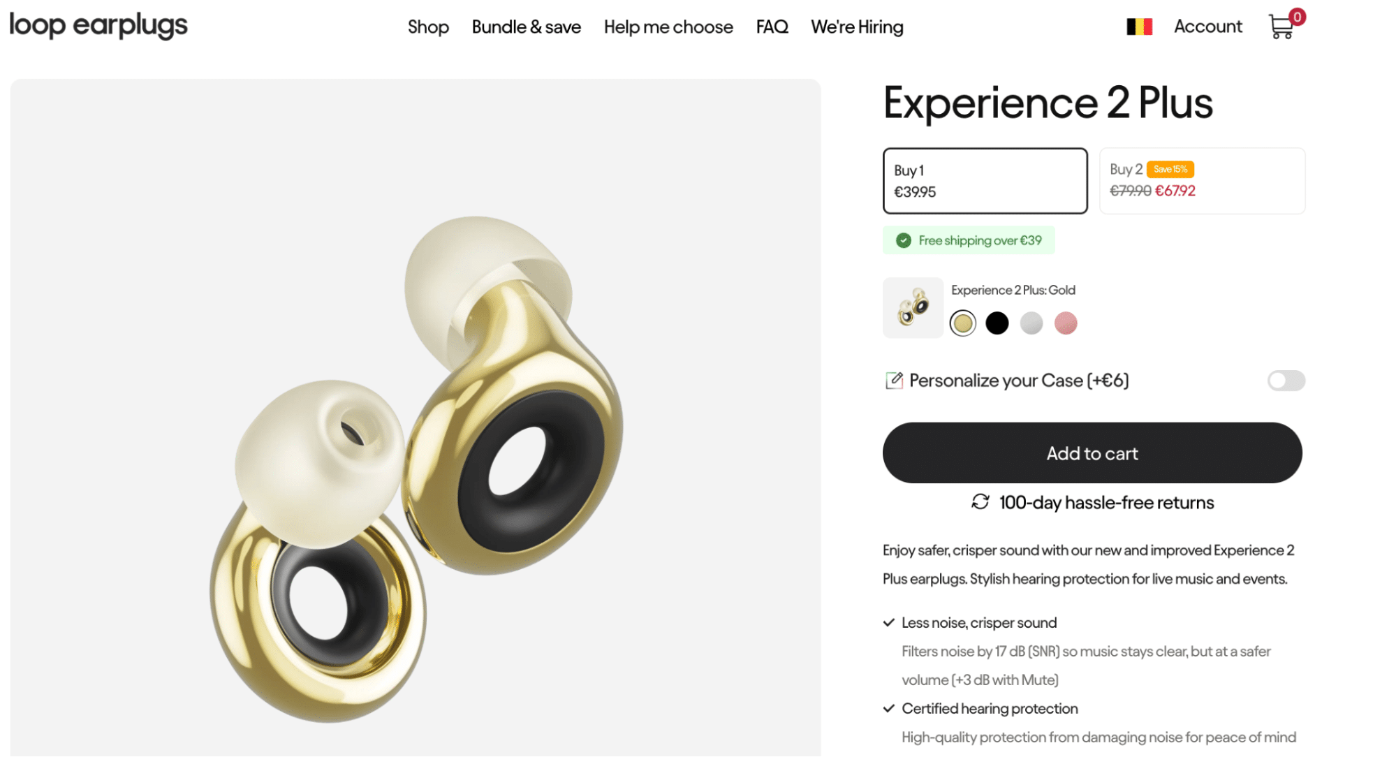 Close-up product display of Loop Experience 2 Plus gold earplugs, showcasing their sleek circular design with black inner loops and soft silicone tips, designed for stylish hearing protection.
